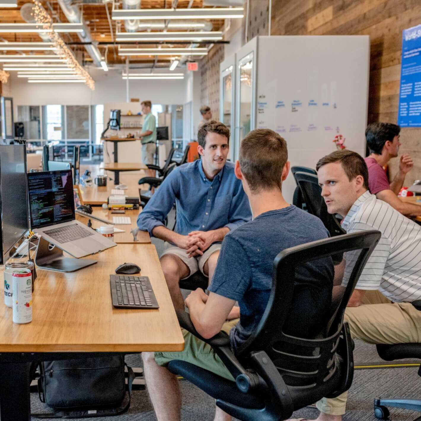 Employees discussing in office environment