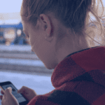 Young woman using her mobile phone