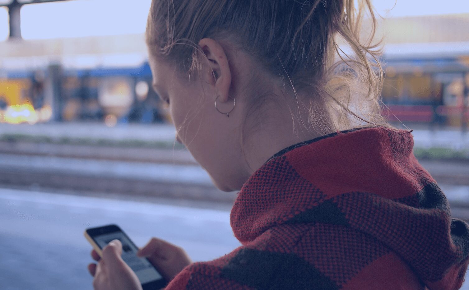 Young woman using her mobile phone