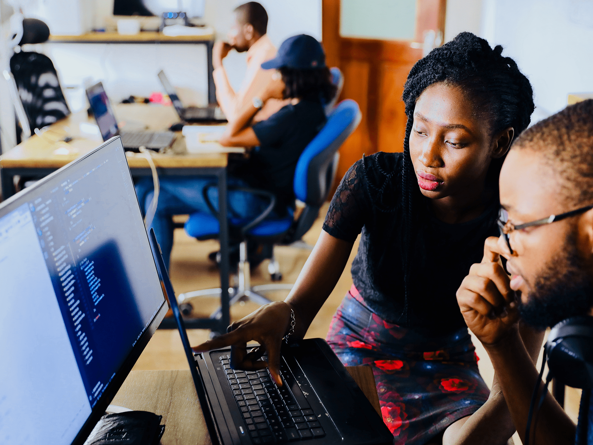 Two people sitting at a computer