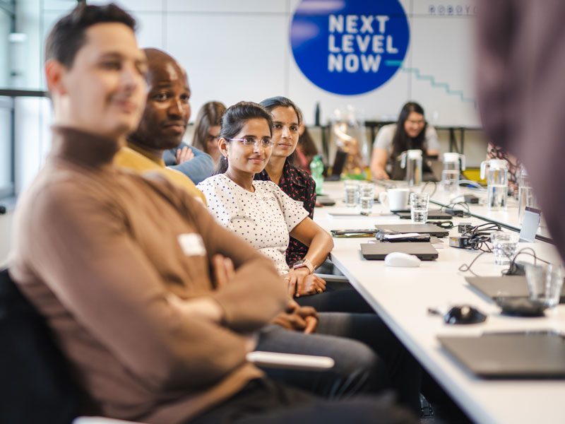 Roboyon's in foreground and background watching presentation