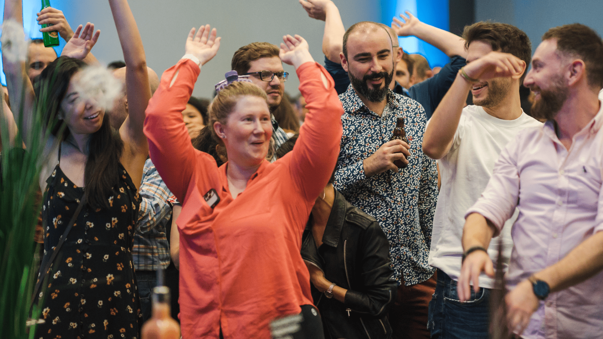 Group of Roboyans with hands in the air